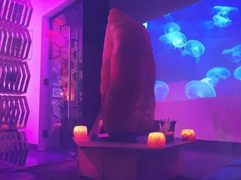 Atmospheric float house lounge with jellyfish projection and ambient lighting
