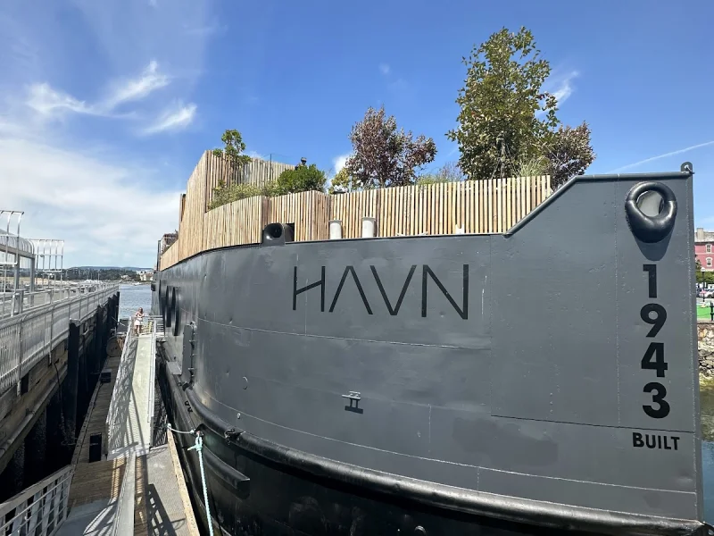 HAVN Saunas waterfront exterior with bold modern facade and blue-sky setting