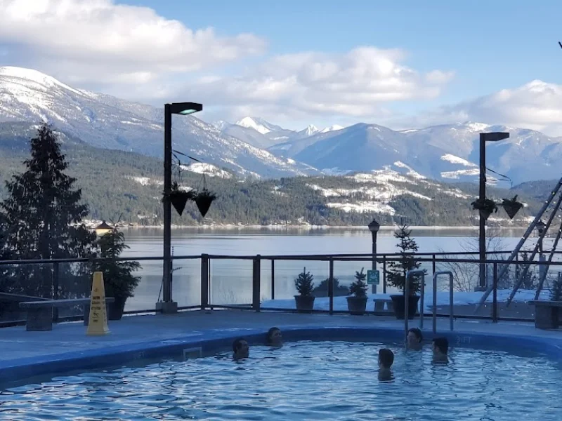 Outdoor heated pool with mountain and lake views at a spa resort