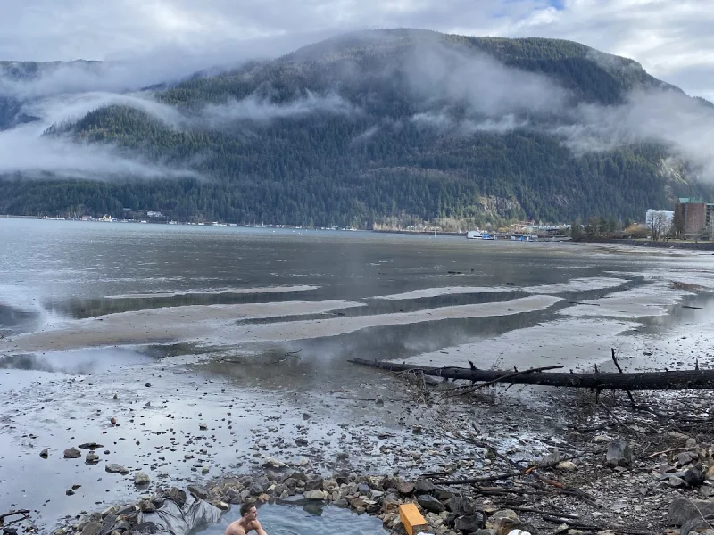 Panoramic mineral soaking pool with mountain backdrop at Harrison Hot Springs