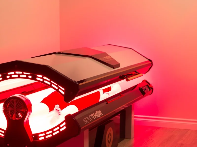 Red light therapy pod in a serene recovery spa room