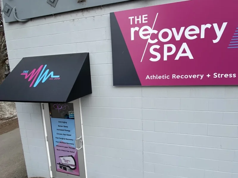The Recovery Spa exterior with branded storefront signage