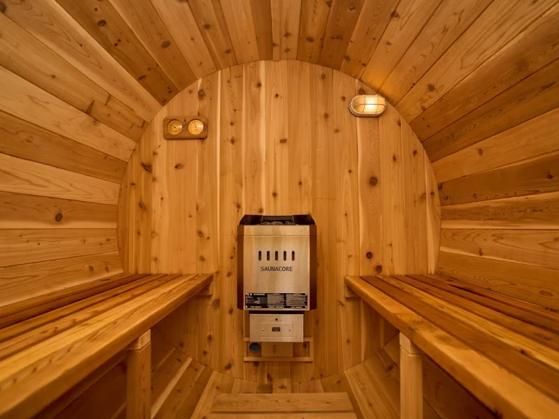 Warm cedar sauna interior with benches and heater